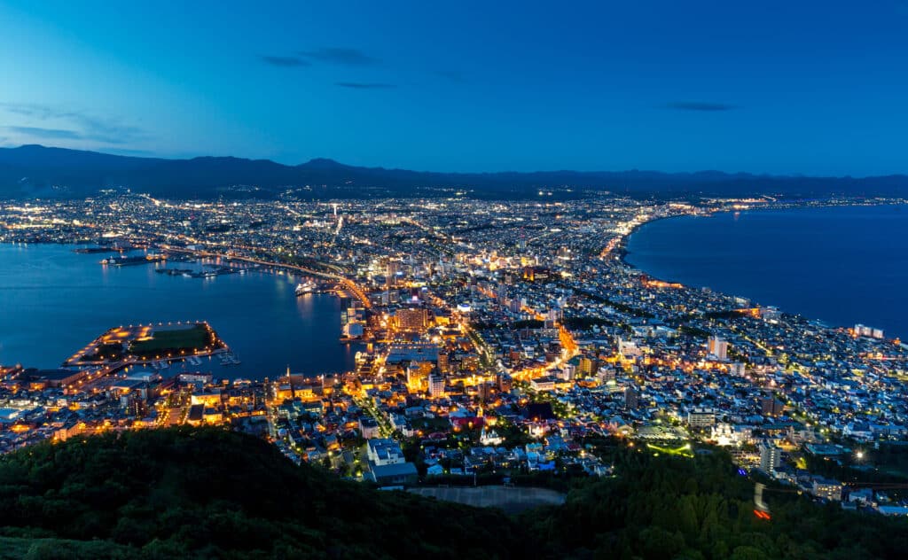 Night skyline view over Hakodate city and coastline in Hokkaido