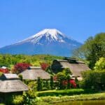 Traditional Japanese village with Mount Fuji in the background on a clear spring day