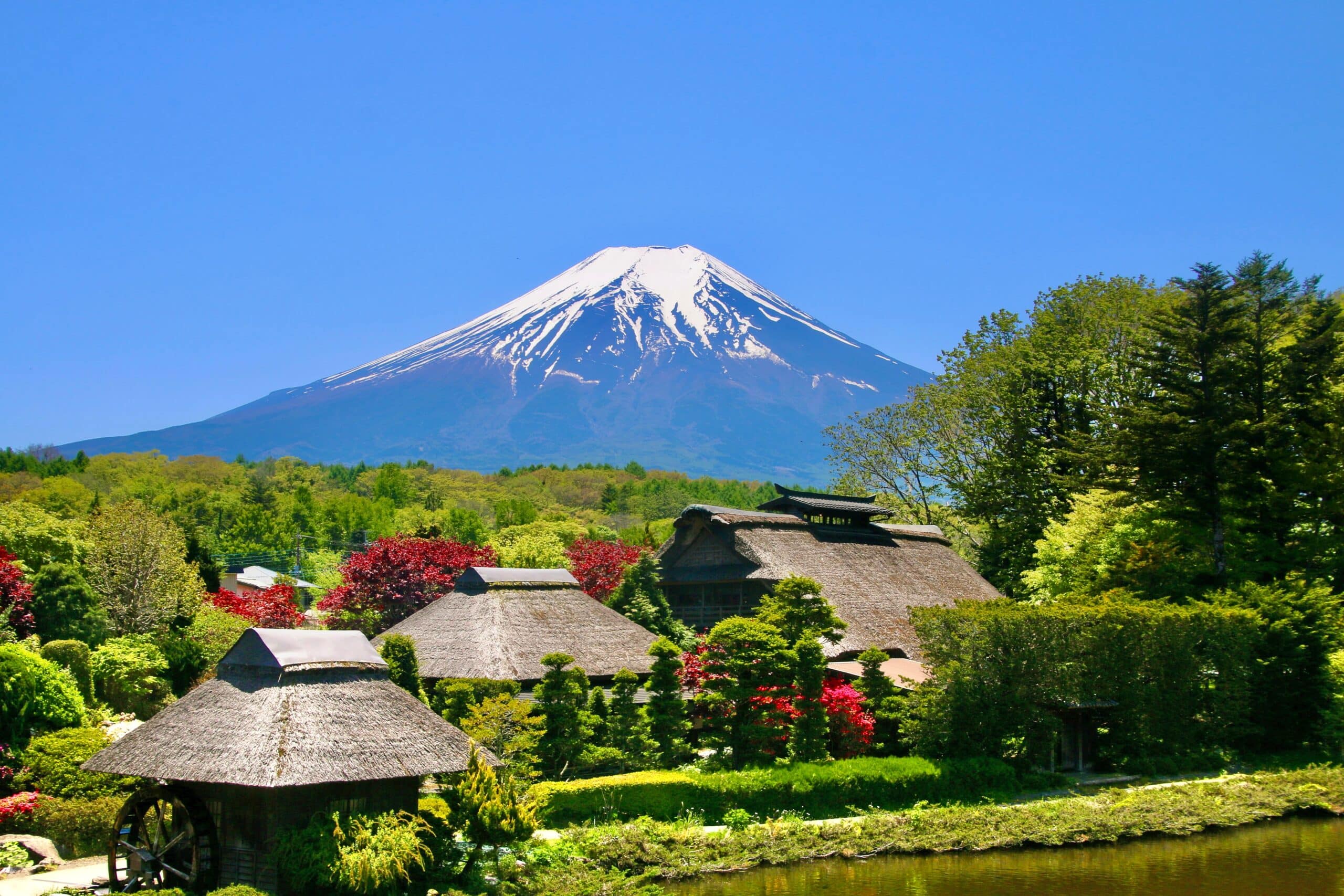 Traditional Japanese village with Mount Fuji in the background on a clear spring day