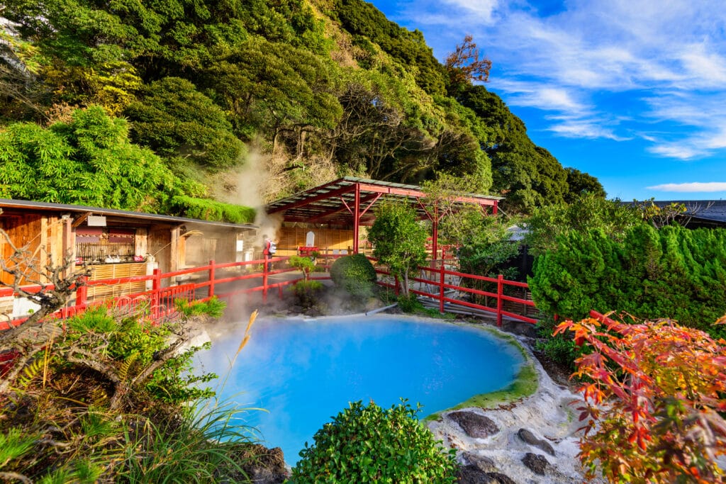 Outdoor hot spring bath with blue mineral water in Japan