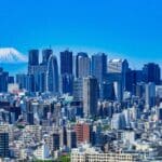 Tokyo skyline with modern skyscrapers and Mount Fuji visible in the background