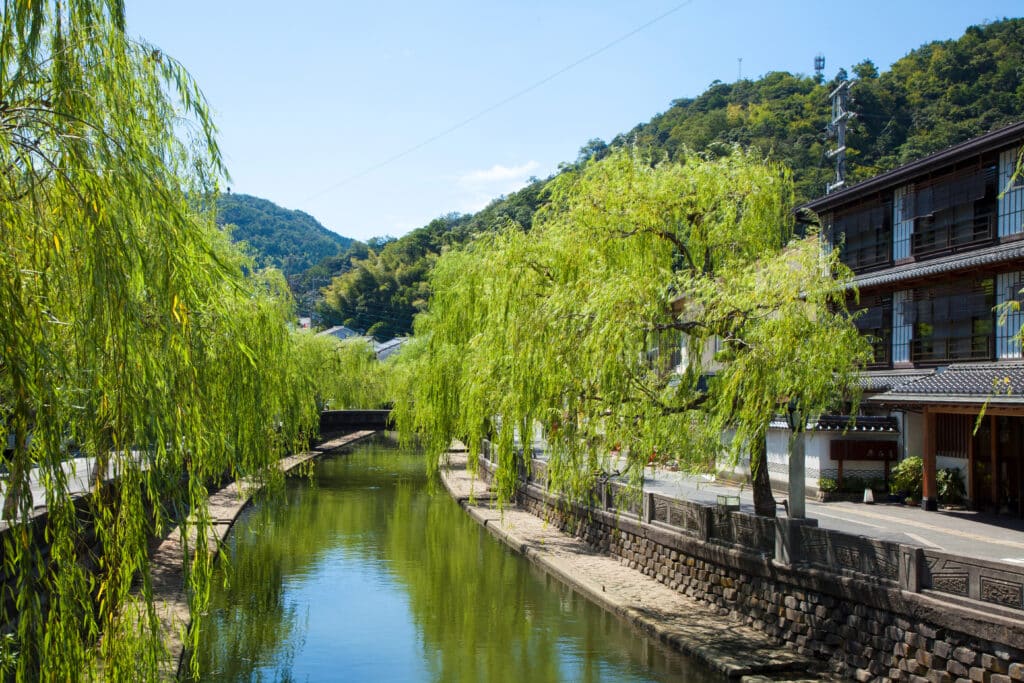 Canal and willow trees in Kinosaki Onsen Japan