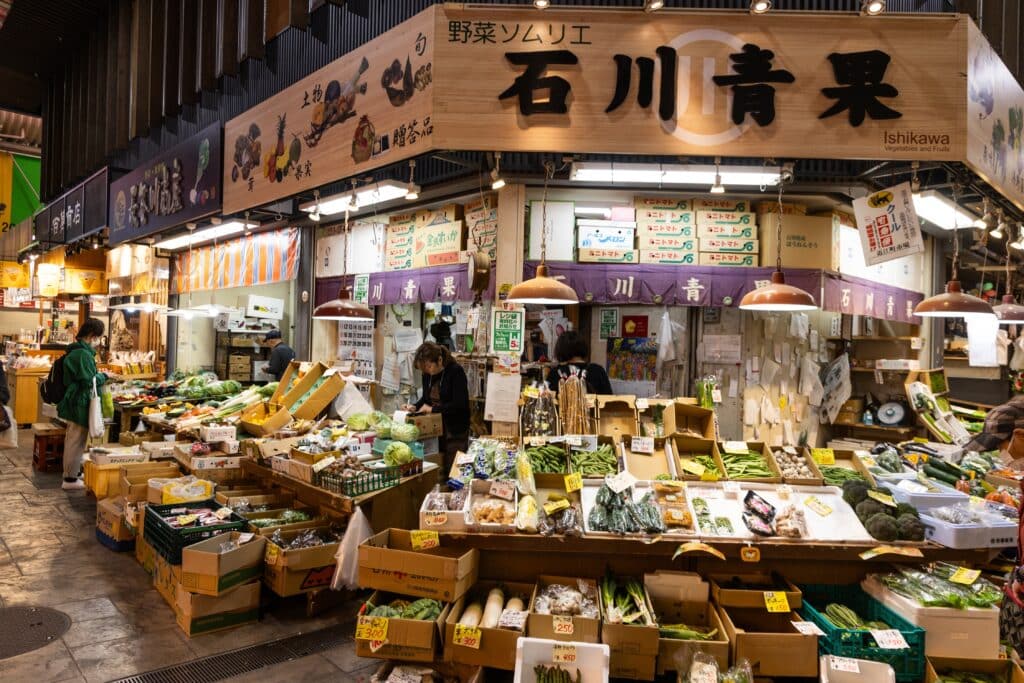 Fresh produce and local food stalls inside Omicho Market in Kanazawa