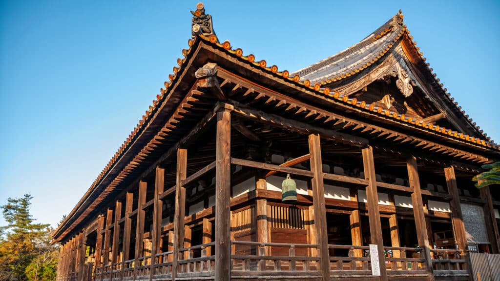 Exterior of Senjokaku Hall with traditional wooden architecture on Miyajima Island