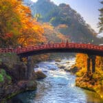 Shinkyo Bridge surrounded by autumn foliage in Nikko