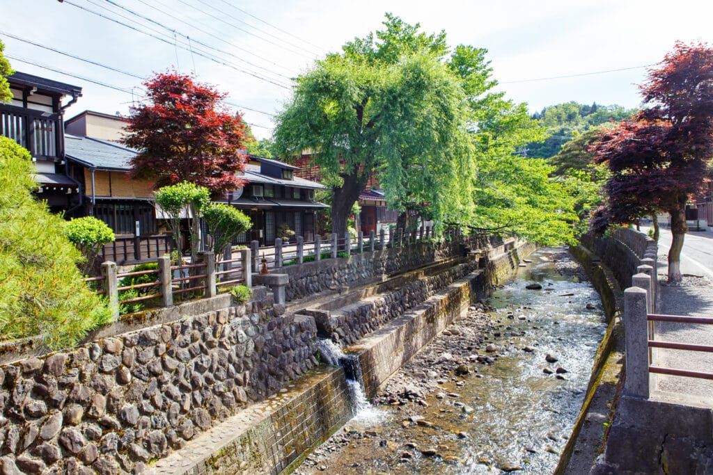 Traditional canal street in Takayama with historic wooden houses