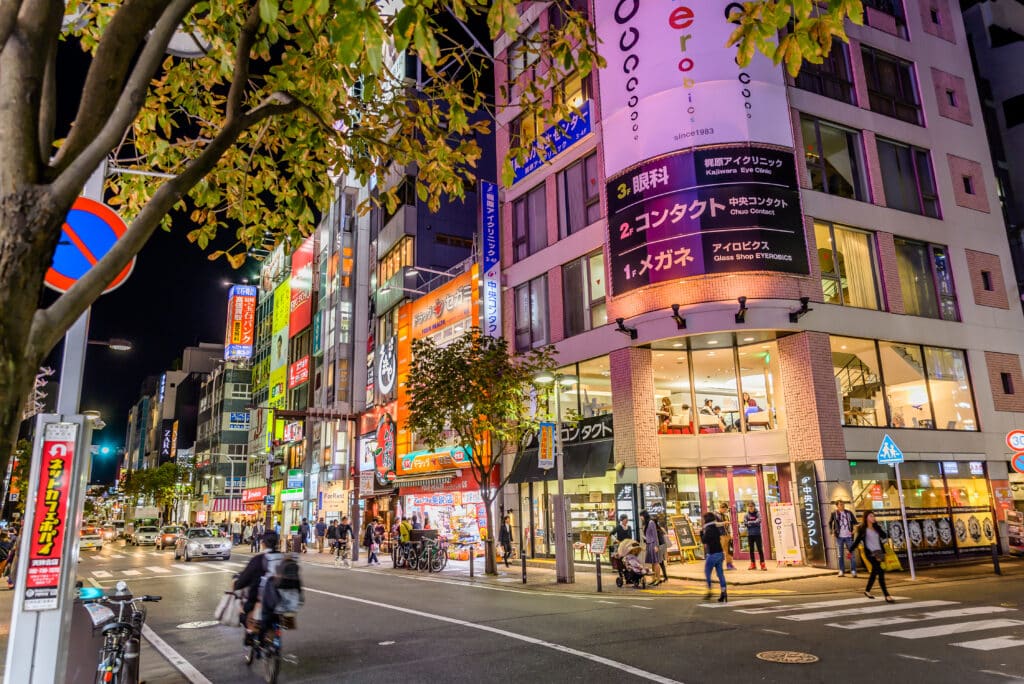 Brightly lit streets and shopping area in Tenjin, Fukuoka at night