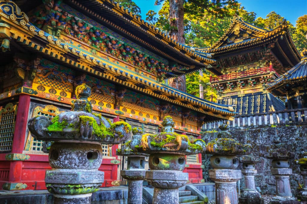 Stone lanterns and ornate buildings at Toshogu Shrine in Nikko