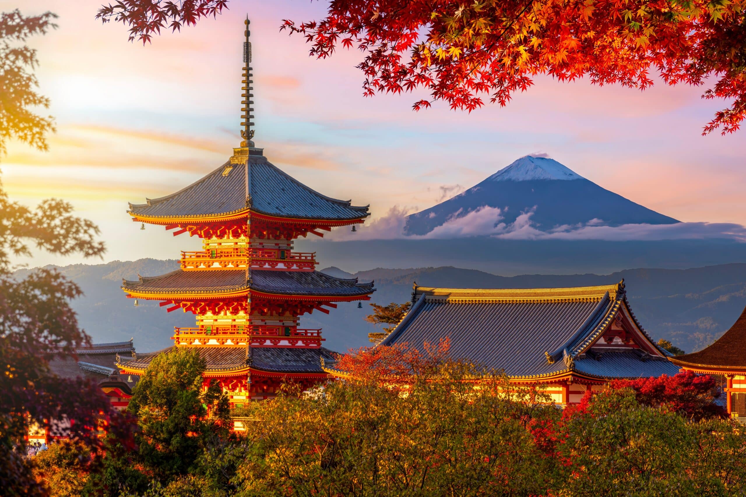 Chureito Pagoda with Mount Fuji surrounded by colorful autumn foliage