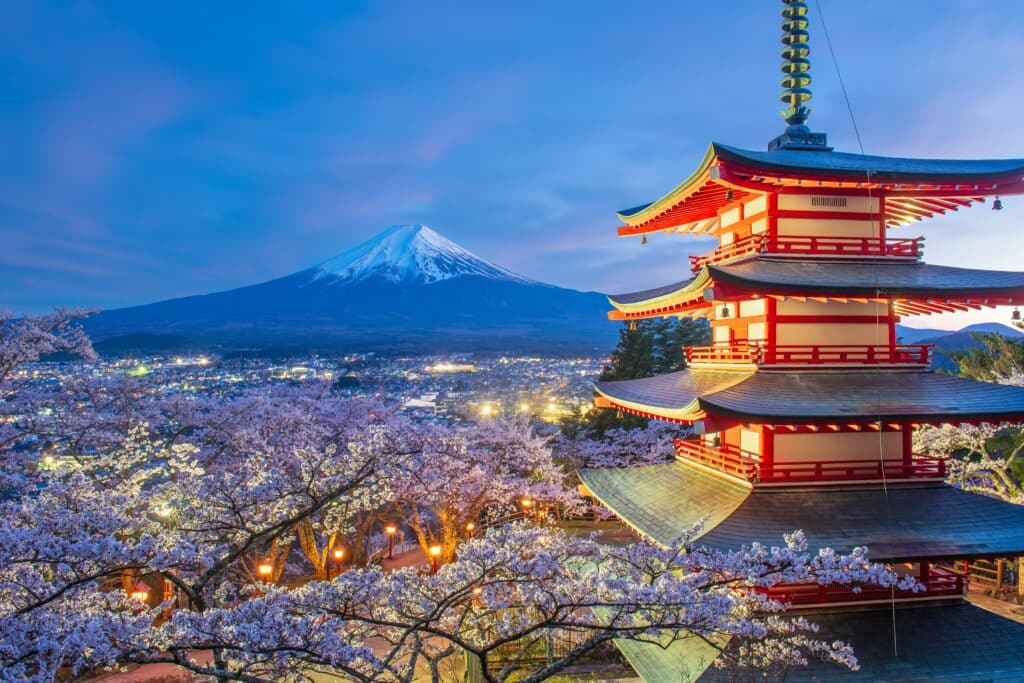 Chureito Pagoda overlooking Mount Fuji during cherry blossom season in Japan