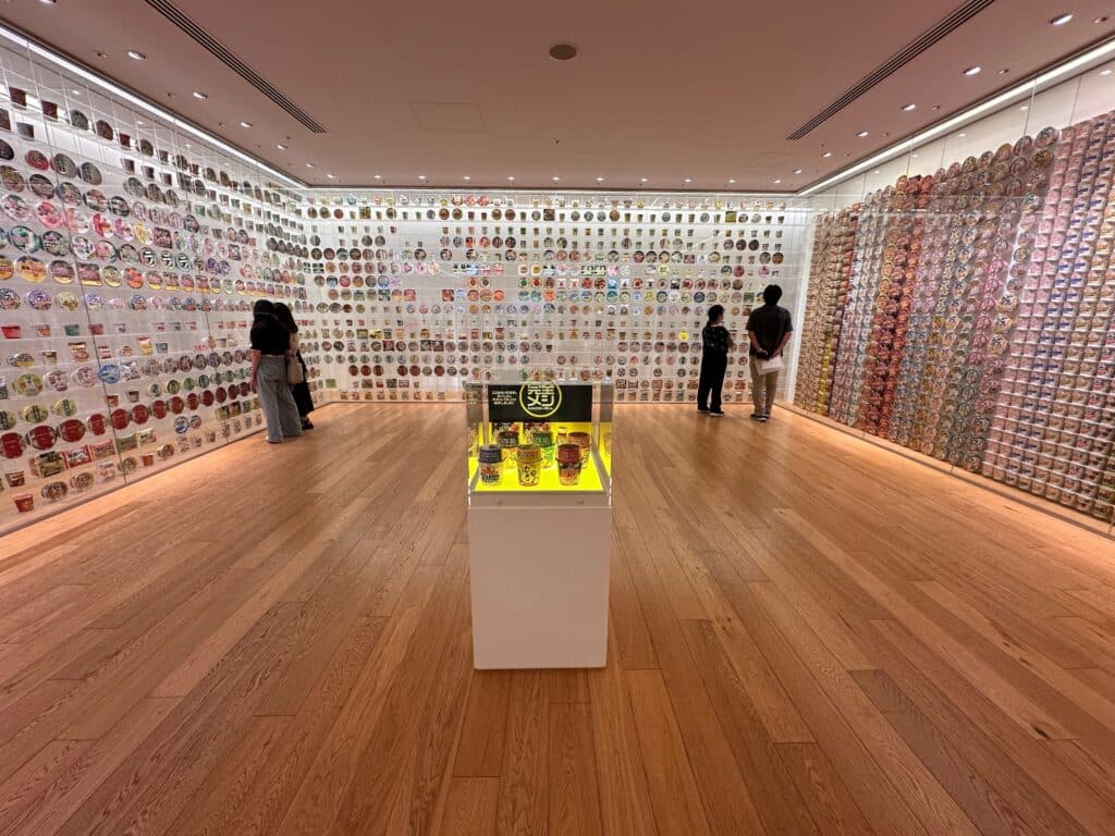 Exhibition wall displaying instant noodle packages at the Cup Noodles Museum Yokohama
