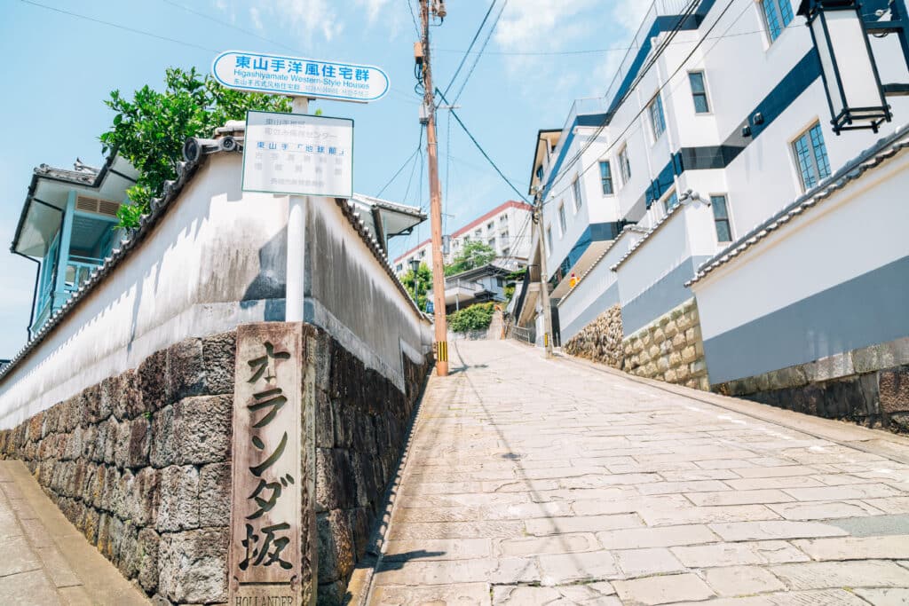 Historic Dutch Slope street lined with stone pavement and Western-style buildings in Nagasaki