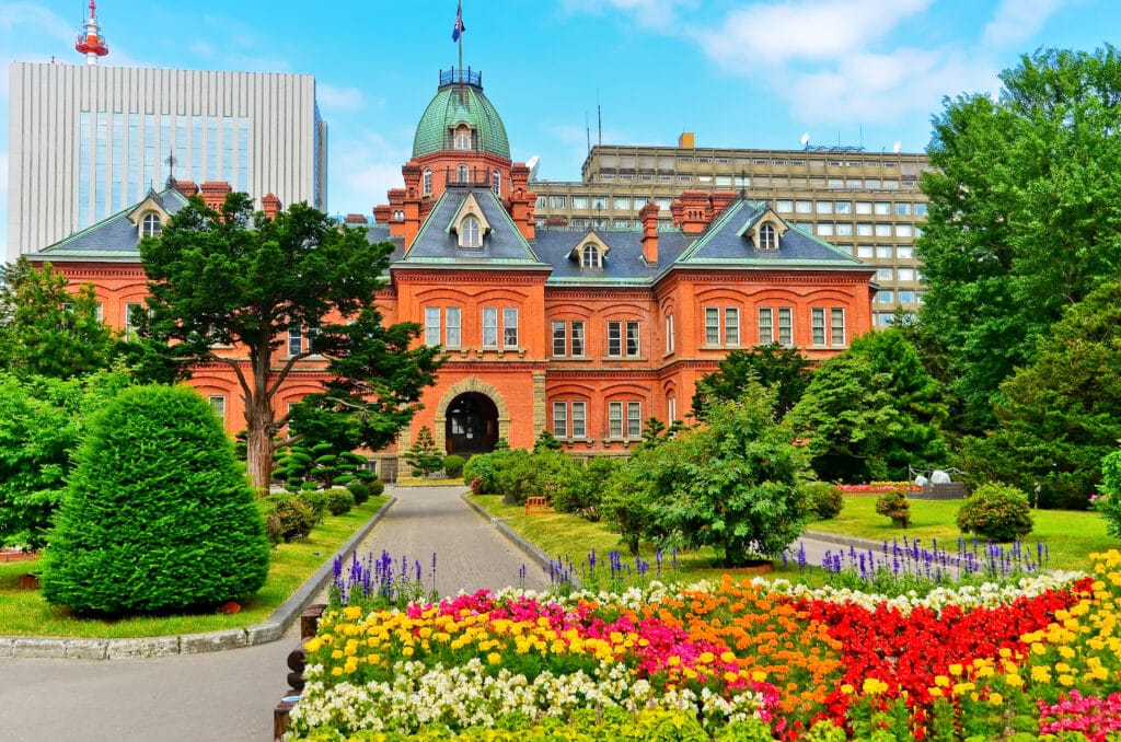 Former Hokkaido Government Office building with colorful flower gardens in Sapporo