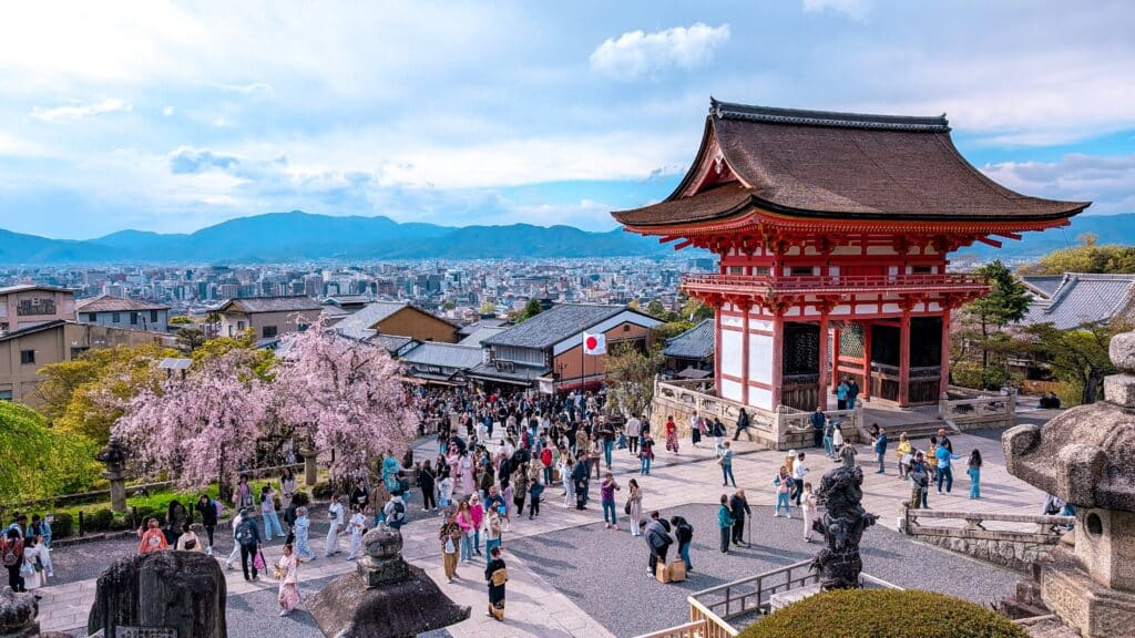 Visitors exploring Kiyomizu-dera Temple in Kyoto during peak travel season