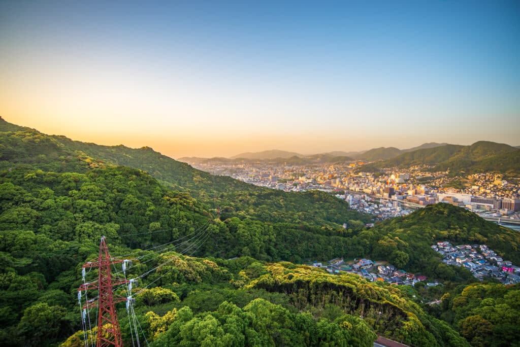 Panoramic view of Nagasaki city and surrounding mountains from Mount Inasa at sunset