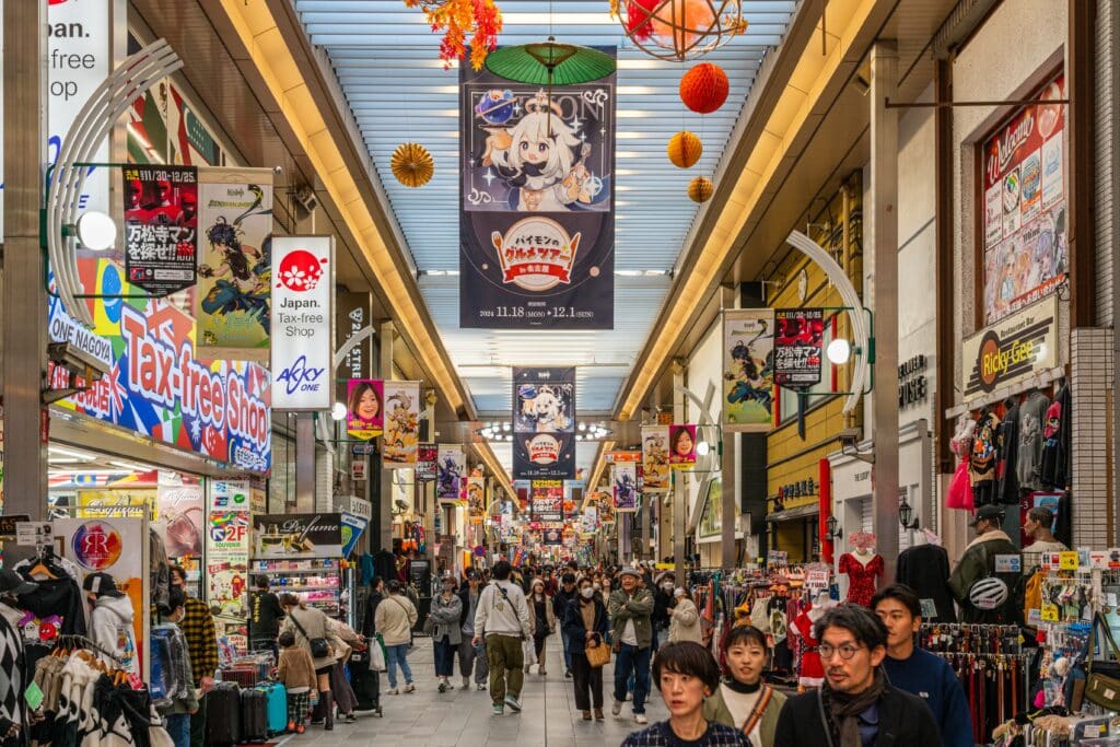 Busy shopping arcade in Osu filled with shops, restaurants, and visitors