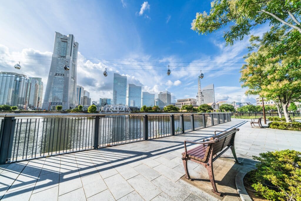 Waterfront promenade in Minato Mirai Yokohama with skyline views, cable cars, and harbor scenery