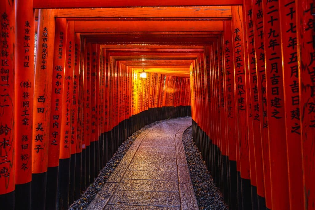 Vermilion torii gates lining the path at Fushimi Inari Shrine in Kyoto