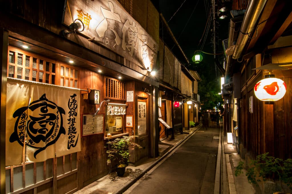 Traditional lantern-lit street in Kyoto's Gion district at night