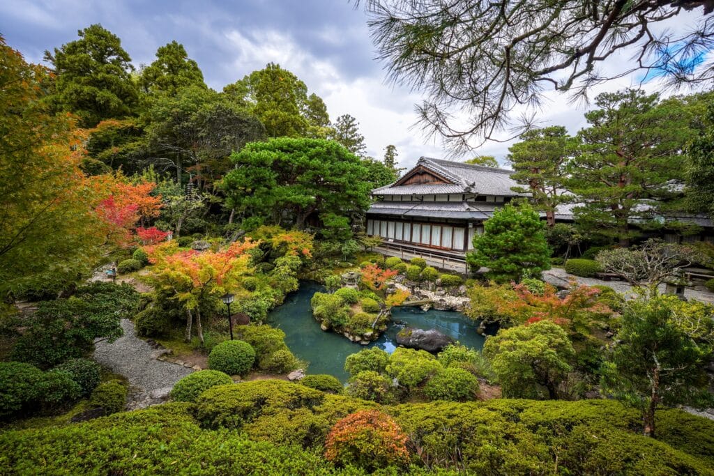 Traditional Japanese garden at Isuien Garden in Nara with colorful autumn foliage and landscaped ponds