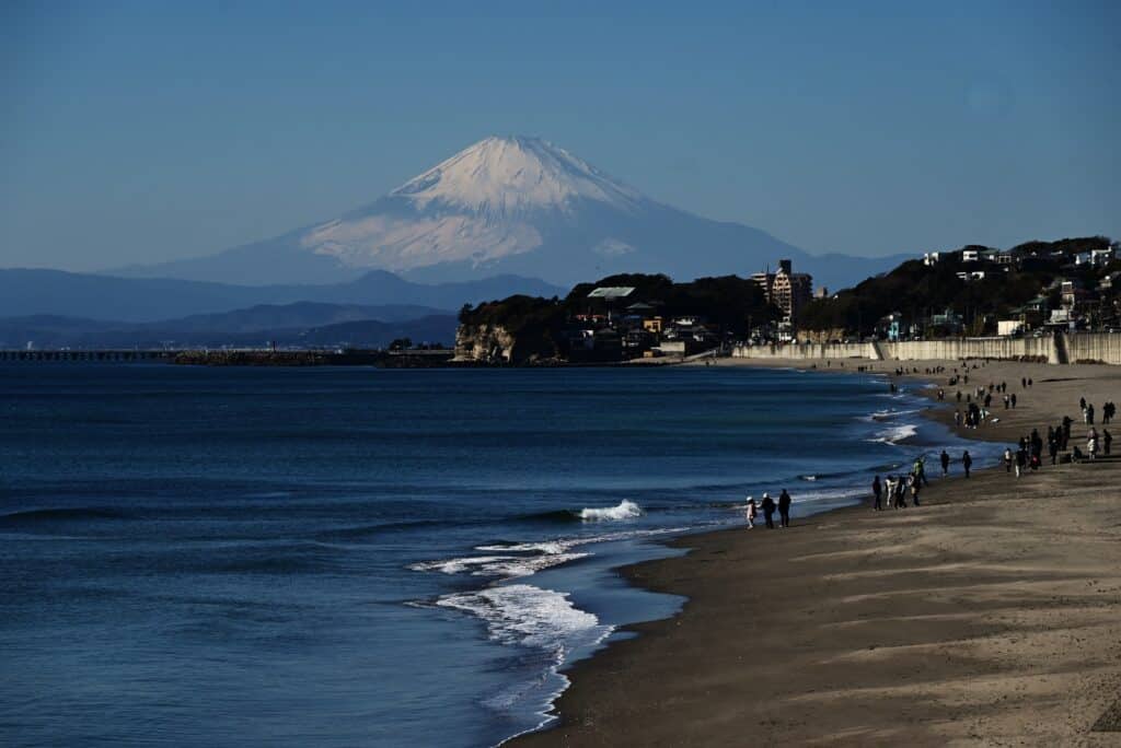 Mount Fuji seen across the sea from the Kamakura coastline
