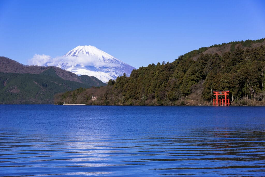 Mount Fuji and Hakone Shrine torii viewed across Lake Ashi