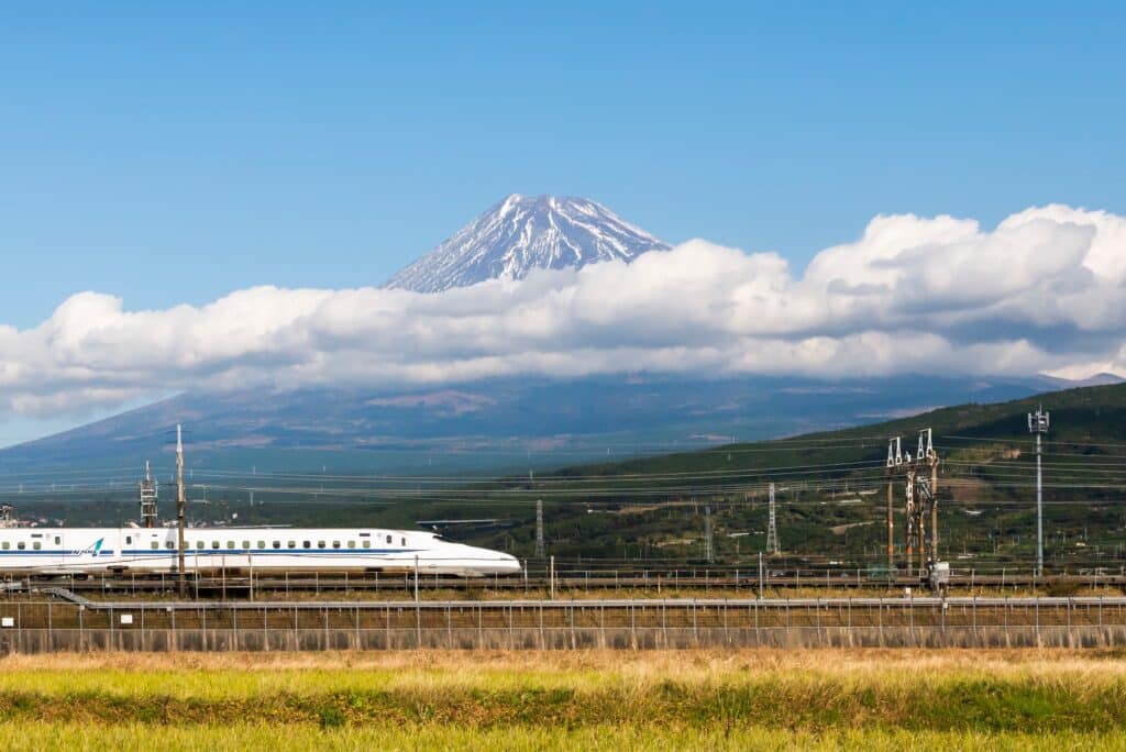 Shinkansen traveling through the Japanese countryside