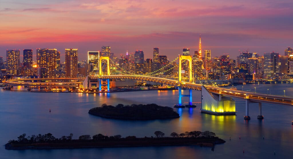Tokyo skyline and Rainbow Bridge at dusk in Japan
