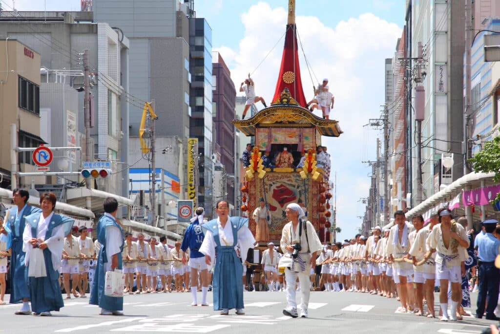 Traditional decorated festival float and participants during Kyoto's Gion Matsuri parade