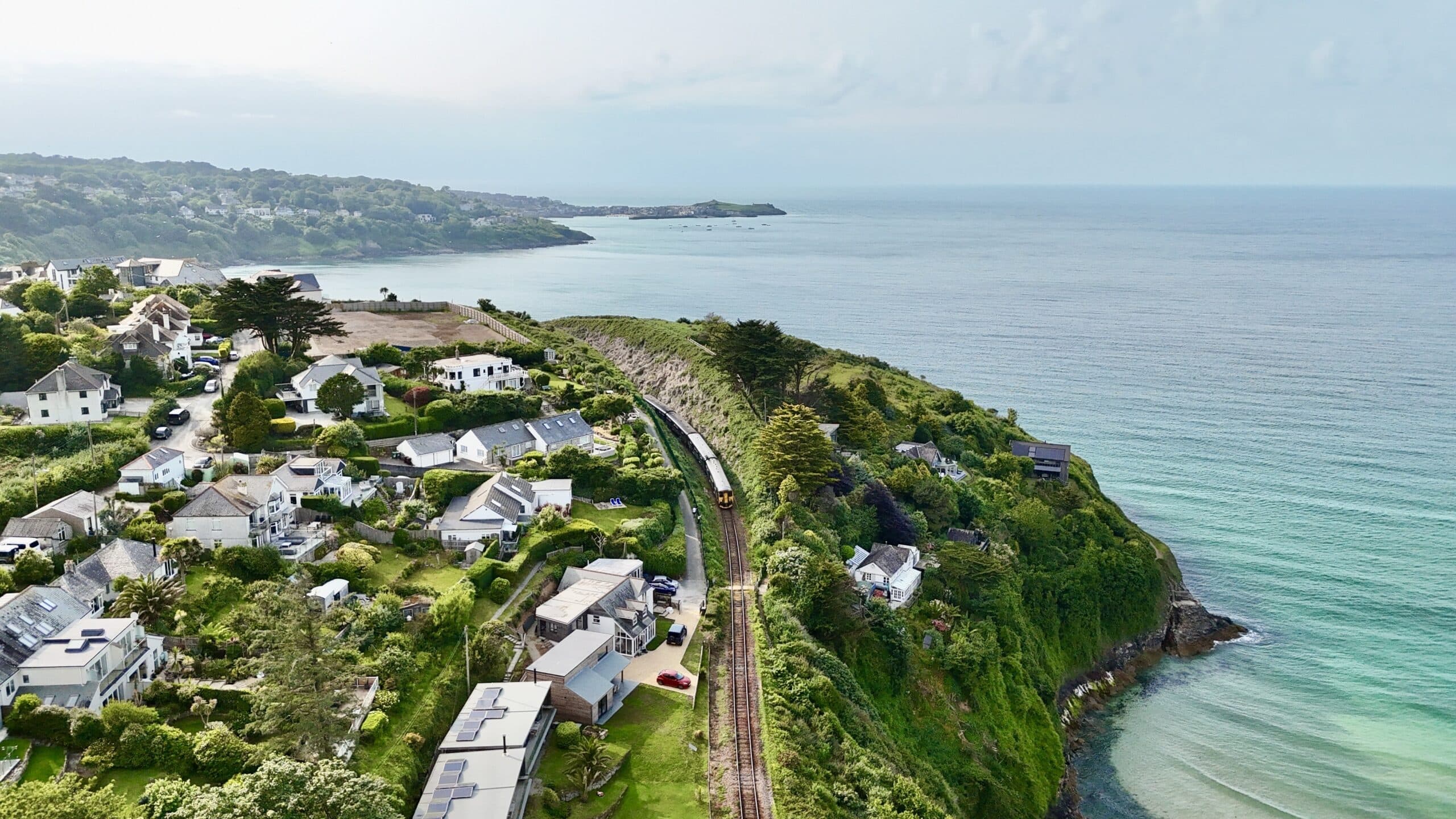 Train travelling along the coast near St Ives in Cornwall