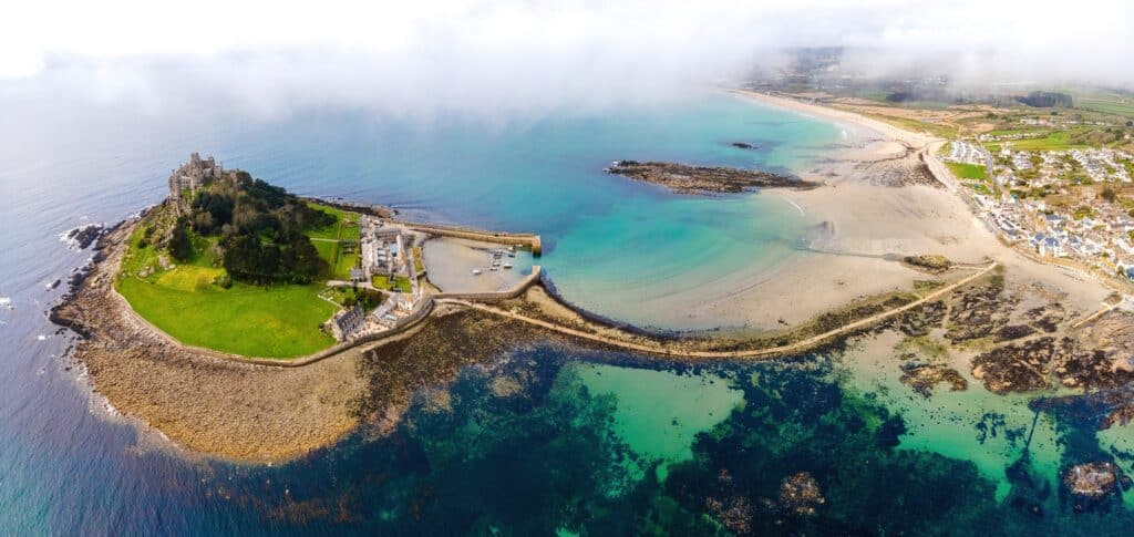 Aerial view of St Michael’s Mount near Marazion, Cornwall, showing the medieval castle, tidal causeway and surrounding beaches